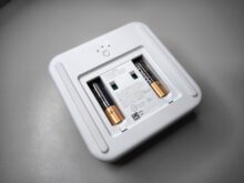 Two AAA batteries are already inserted.