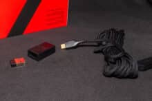 The disassembled USB dongle with charging cable