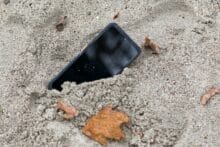 Smartphone stuck in the sand