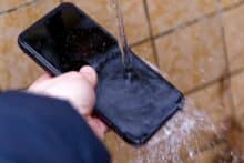 Smartphone is washed with water