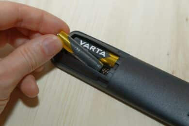 Batteries are inserted into a remote control