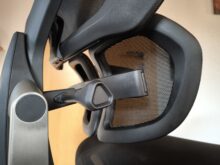 Lumbar support lockable forwards and backwards