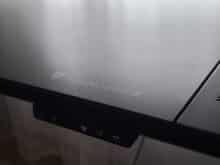 The manufacturer's lettering is located under the tempered glass.