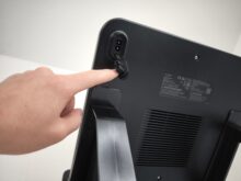 The mains connection is located at the top end of the charging dock.