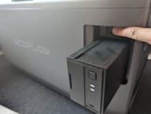 Finger presses release button to remove the EcoFlow battery