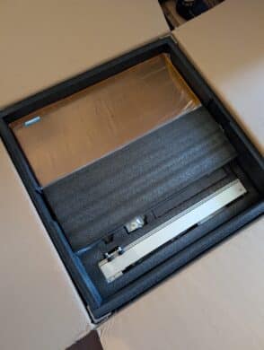 Toocaa L2 20W laser engraver - first layer of packaging with orange acrylic glass and foam padding