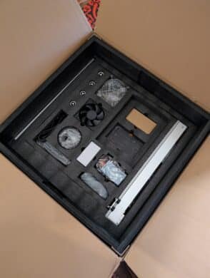 Toocaa L2 20W - bottom packaging layer with fan, power supply unit, screw set and pre-assembled axle.