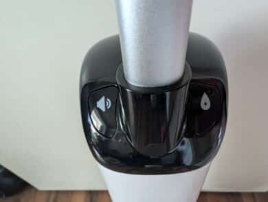 Control panel on the appliance with buttons for self-cleaning and voice function.