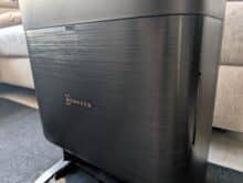 Ecovacs Deebot X9 Pro Omni All-in-One Station with black textured surface and visible fingerprints