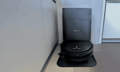 Ecovacs Deebot X9 Pro Omni robot vacuum on its compact all-in-one station in a modern kitchen