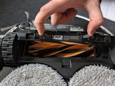 Hand removes brush guard on the Mova V50 Ultra