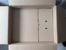 Cardboard insert with two compartments made of corrugated cardboard