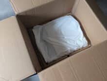 Cleaning station of the Mova V50 Ultra Complete packed in fleece