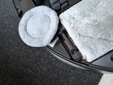 MOVA Z50 Ultra underside with visible mini edge mop next to the HydroSync mop roller for better edge cleaning