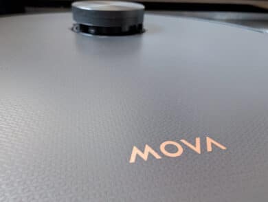 Close-up of the textured surface of the MOVA Z50 Ultra with gold brand logo and LiDAR sensor in the background