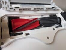 Roborock Qrevo CurvX with brush cover removed shows the DuoDivide system