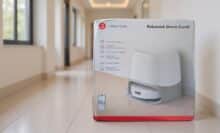 Packaging of the Roborock Qrevo CurvX robot vacuum cleaner in a hallway