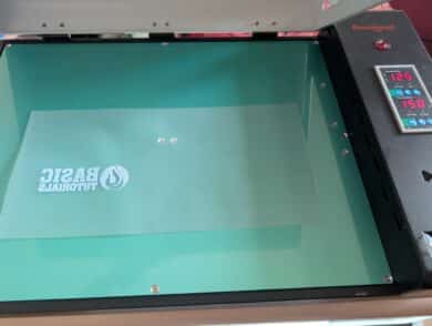 Printed motif on DTF film in an open curing oven at 124 degrees