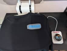 Black T-shirt with BASIC TUTORIALS transfer on top before the pressing process